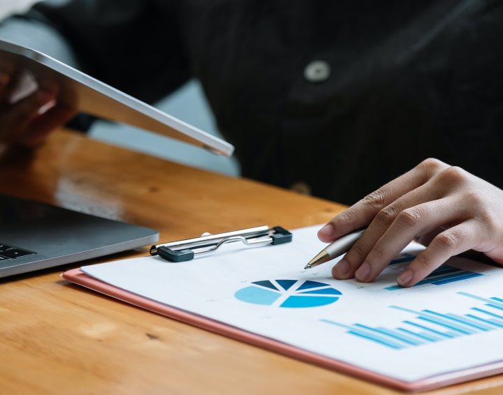 Business woman using tablet computer for analysis financial report